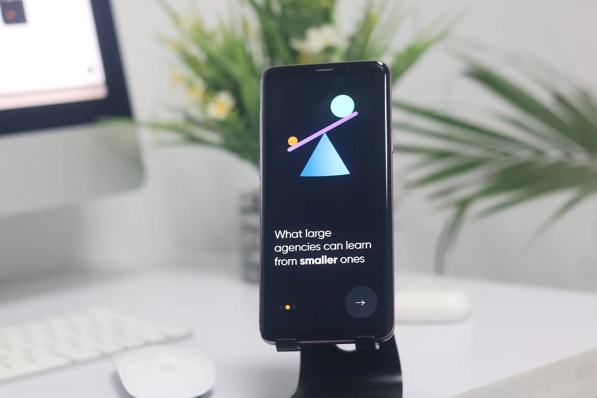 The mobile app on a phone stand
