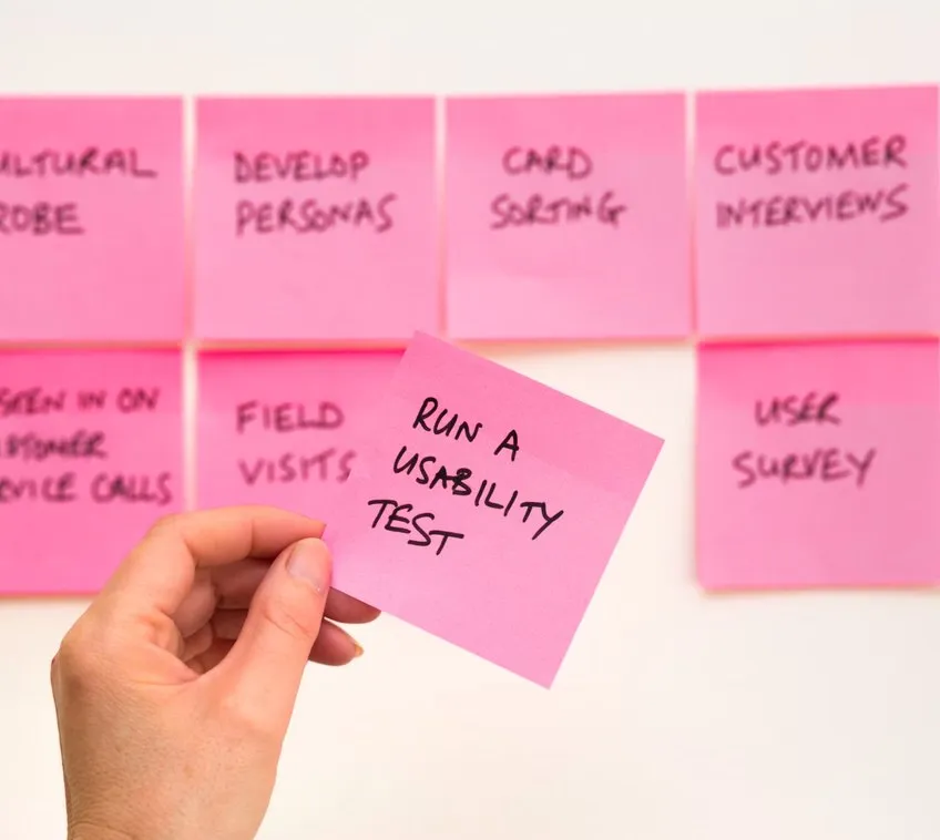 Research sticky notes, one reading “Run a usability test”