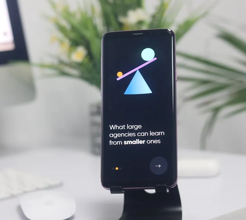 The ProUX mobile app on a phone stand